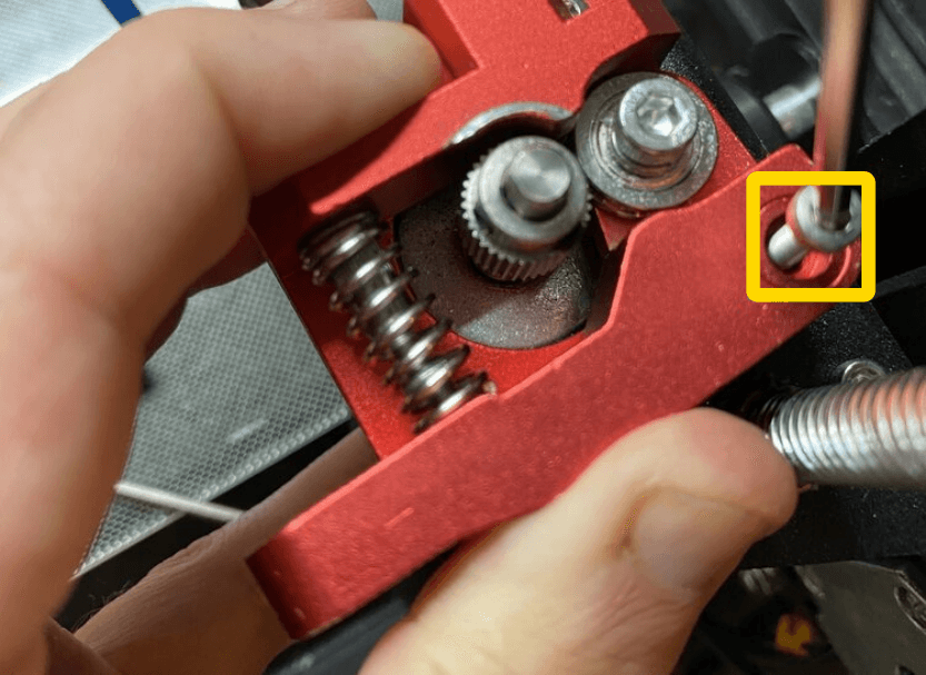 Install the arm and spring